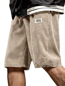 Men's loose beige jacquard plaid casual shorts with textured fabric and side pockets