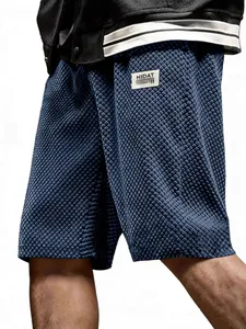 Men's navy blue waffle texture casual shorts with a loose fit, perfect for summer wear