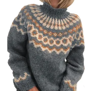 Close-up of blue chunky knit turtleneck sweater with vintage Nordic jacquard pattern detail