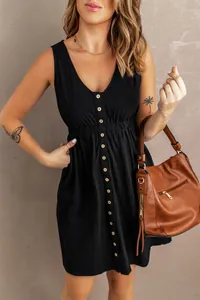 Close-up of black sleeveless V-neck dress with button-down front and waist detail