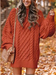 Primer plano de vestido de punto trenzado extragrande color naranja óxido en otoño