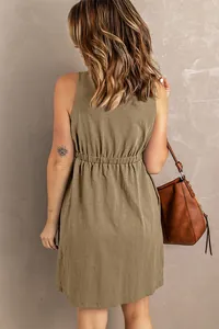 Back view of a khaki sleeveless mini dress with a cinched elastic waist