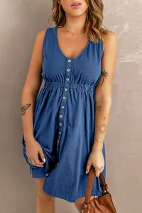 Detail showing the v-neck button-down front and elasticated waist of the blue mini dress
