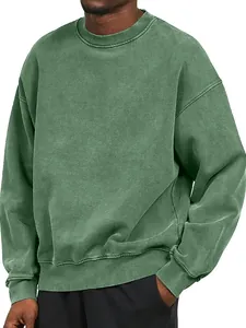 Close-up of green acid-wash sweatshirt with heavy fabric texture and ribbed cuffs.