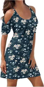 Detail view of cold-shoulder floral summer dress with a vibrant beach print pattern.