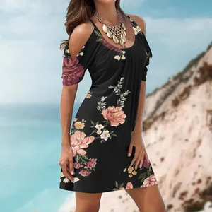 Women's black floral print summer beach dress with cold-shoulder and scoop neck detail.