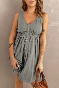 Detail view of grey sleeveless V-neck mini dress with button-front and elastic waist.