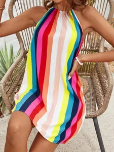Detailed view of vibrant rainbow striped halter mini dress for summer beach wear