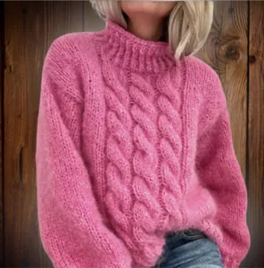 Detailed view of women's pink high-neck cable knit chunky sweater with soft knit
