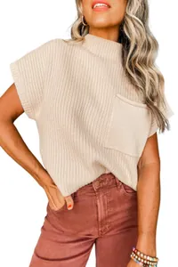 Detailed shot of beige ribbed knit sweater vest featuring front pocket and mock neck