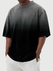 Detailed view of men's washed gradient T-shirt with vintage grey to black ombre effect