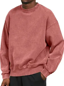 Close-up detail of a men's heavyweight red acid wash sweatshirt with a ribbed crewneck