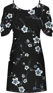 Detailed view of floral print on cold-shoulder beach dress with blue blossoms