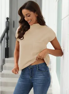 Detailed view of beige ribbed short sleeve turtleneck sweater vest with pocket detail.