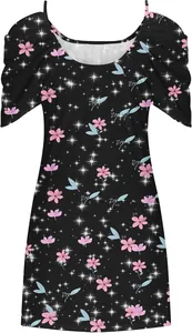 Detail view of black summer beach dress featuring pink floral and sparkle star print