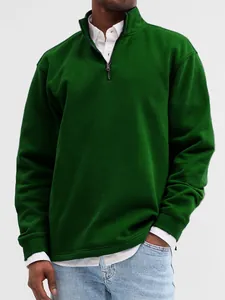Close-up of men's forest green quarter-zip sweatshirt with high stand collar.