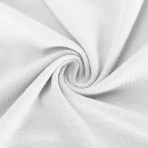Detailed macro shot of soft white knitted fabric texture with elegant swirl pattern