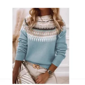 Close-up of women's blue Fair Isle jacquard turtleneck knitted sweater with cozy texture