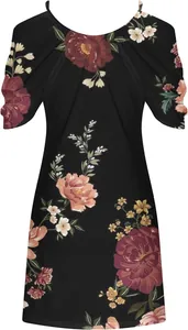 Detail of vintage floral print on a black summer beach dress with spaghetti straps.
