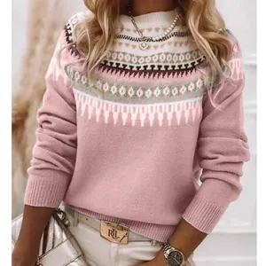 Detail shot of pink knit sweater featuring ethnic Fair Isle jacquard pattern on yoke