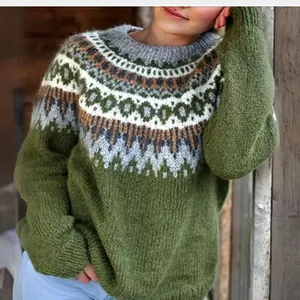Close-up detail of a women's chunky knit Nordic jacquard sweater in forest green and grey colors
