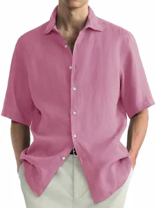 Detail view of a men's casual pink short-sleeved washed cotton button-down shirt.