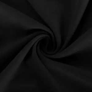 Macro view of the soft black knitted fabric texture for women's elegant shawl cardigan.