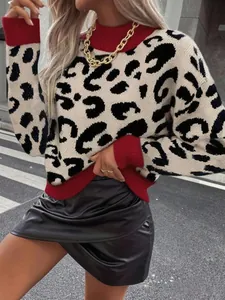 Detail of leopard print knit sweater with red ribbed turtleneck and cuffs for women.