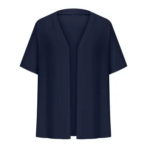Detail of a dark navy blue women's short sleeve open front cardigan shrug.