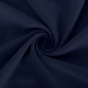 Close-up macro view of soft navy blue knitted fabric texture showing elegant drape