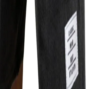 Close-up of corduroy shorts fabric with a white classic wear label detail.