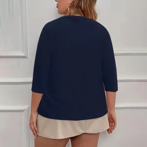 Detailed back view of an elegant plus size dark blue short sleeve knit cardigan top