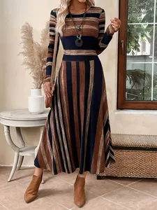 Elegant round neck long sleeve striped maxi dress with a flattering cinched waistline