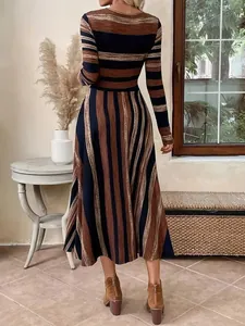 Back view of a long sleeve striped maxi dress with an A-line flared skirt