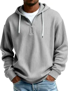 Detailed view of a grey ribbed men's hoodie with a functional quarter-zip closure.