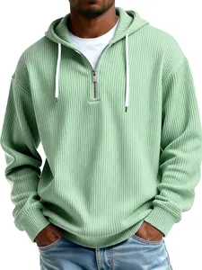 Detail view of light green ribbed quarter-zip hoodie for men with white drawstrings