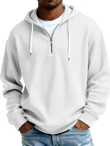 Detailed view of men's white ribbed quarter-zip hoodie showing texture and quality