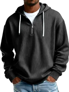 Detailed view of grey ribbed texture on a men's quarter zip hooded sweatshirt.