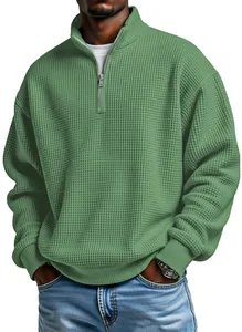 Detailed view of men's olive green waffle knit pullover sweater with 1/4 zip design