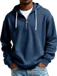 Close-up view of a men's navy blue ribbed quarter-zip hoodie with white drawstrings