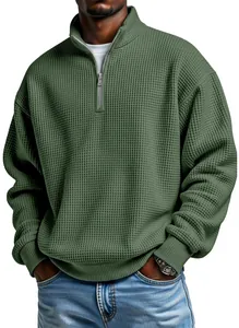 Close-up of men's olive green waffle knit quarter-zip long sleeve casual sweatshirt.