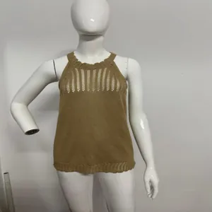 Detailed macro view of the camel hollow-out sleeveless knit top on a white mannequin