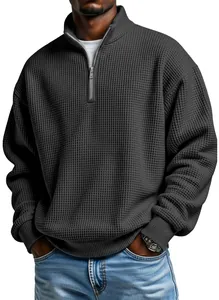 Close-up detail of men's quarter-zip waffle knit pullover sweatshirt in charcoal grey.