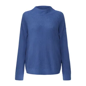 Detailed view of women's blue mock neck cable knit sweater with ribbed textures