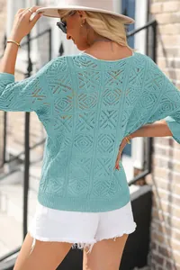 Back view of light blue crochet hollow-out knit sweater with three-quarter sleeves