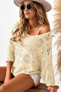 Close-up of cream crochet hollow knit sweater with elegant off-shoulder design on model