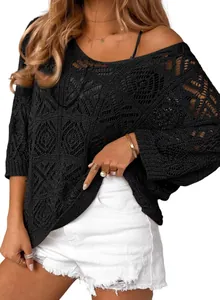 Detail view of a black crochet hollow-out off-shoulder sweater for women in spring.