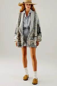 Detail view of a cactus jacquard fringed cardigan with an oversized lapel and knit finish.