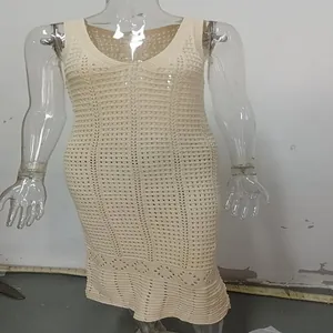 Close-up macro view showing the intricate cream knitted hollow-out pattern on this beach cover-up dress