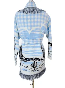 Detailed back view of a light blue and white cactus jacquard knit cardigan with fringe